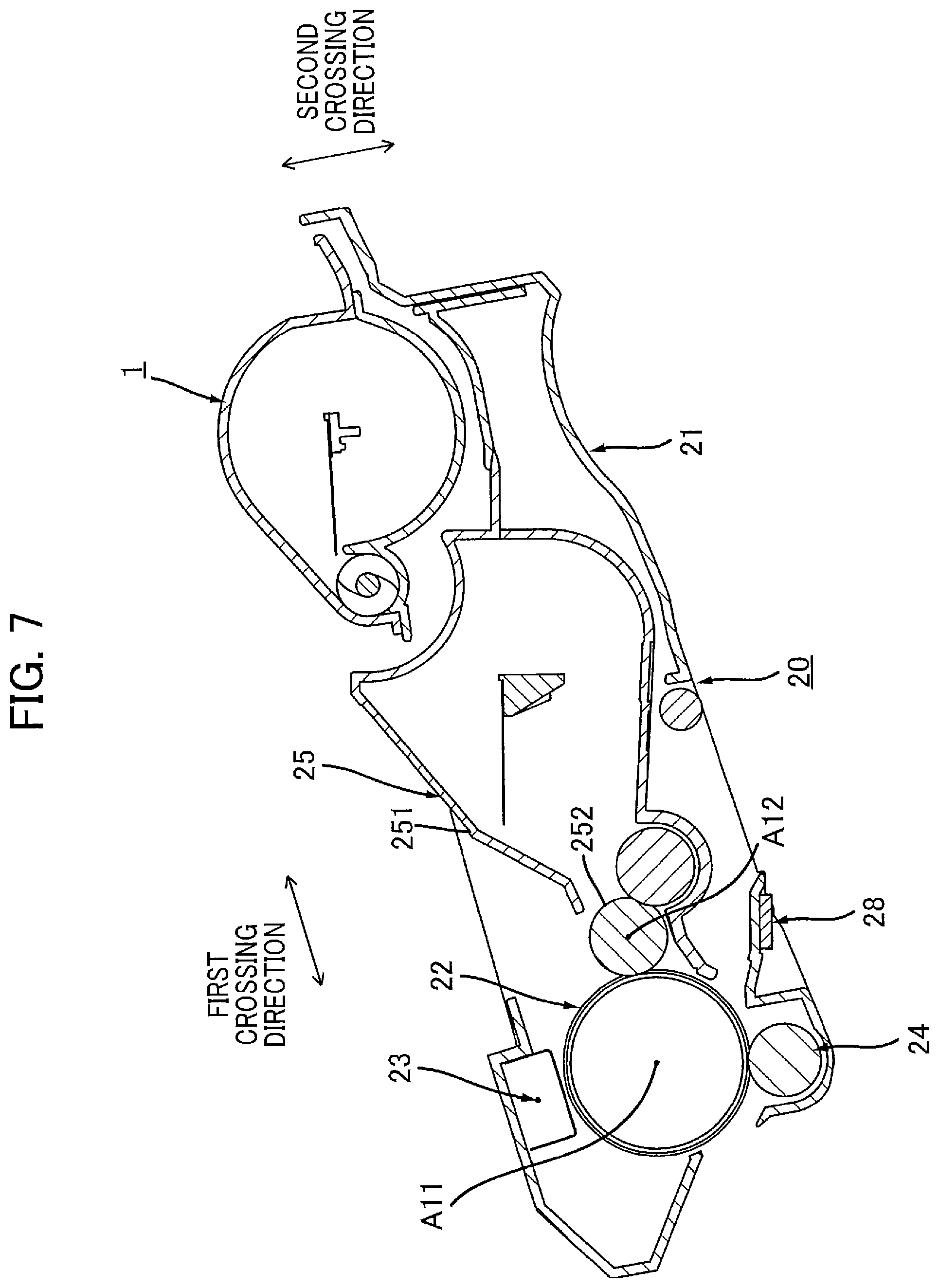 Patent US12174559 Figure 7 – Toner cartridge having electrical contact surface that can contact electrical contact surface of drum cartridge in accordance with pivotal movement of casing