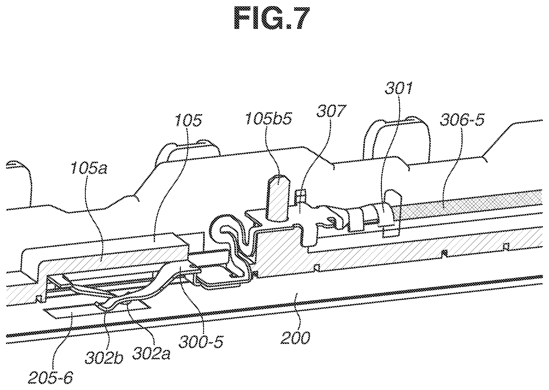 Patent US12321117 Figure 7 – Fixing device in which a power supply terminal in contact with an electrode of a heater and a power supply cable are arranged in an internal space of a film