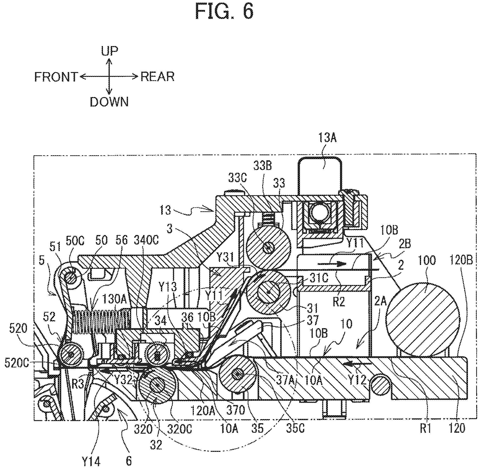 Patent US12351355 Figure 6 – Label wrapping device including first and second members arranged to partially overlap each other in width direction of label to correct curling tendency of label