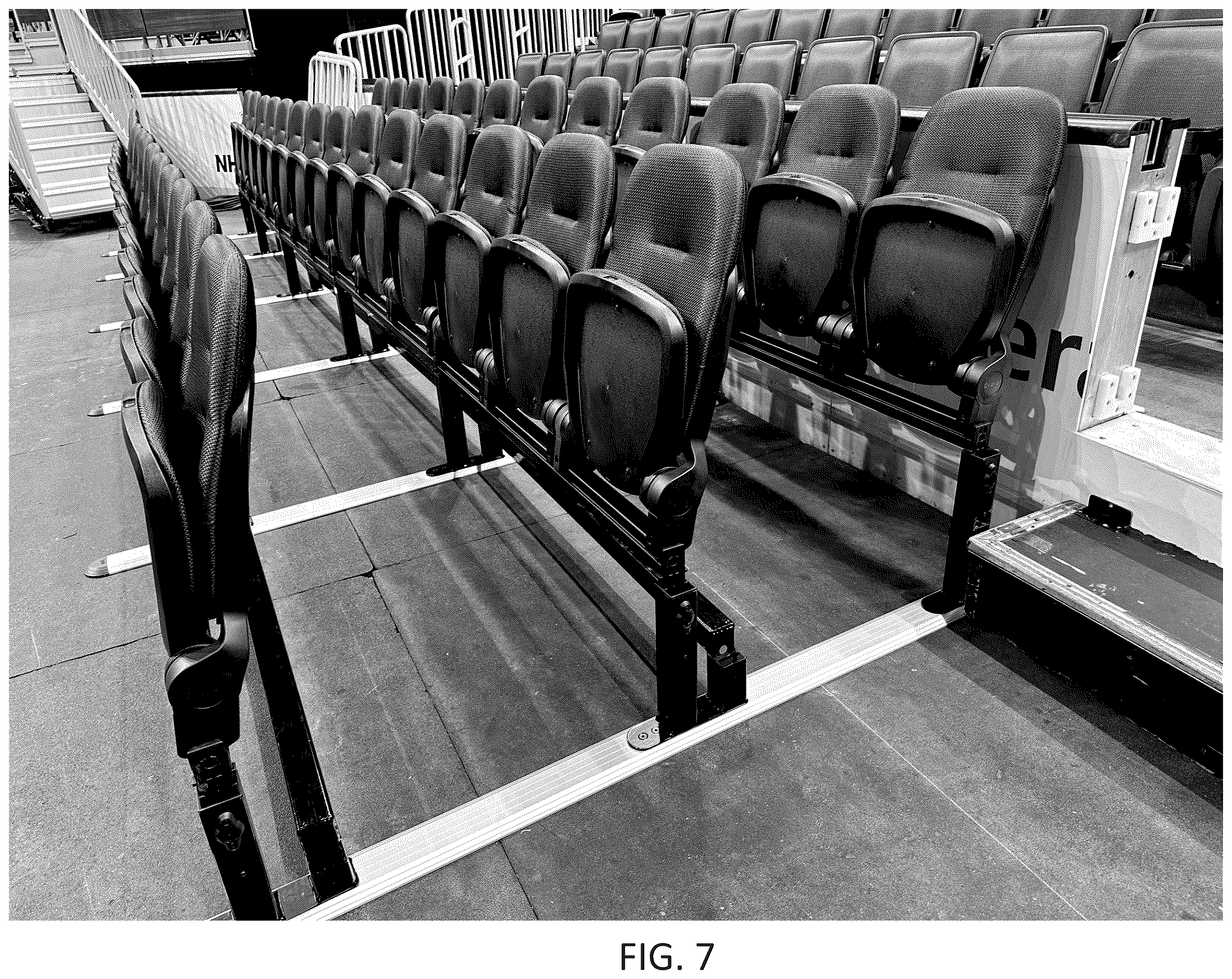 Patent US12551014 Figure 7 – Adjustable floor track and seating system for tiered seating