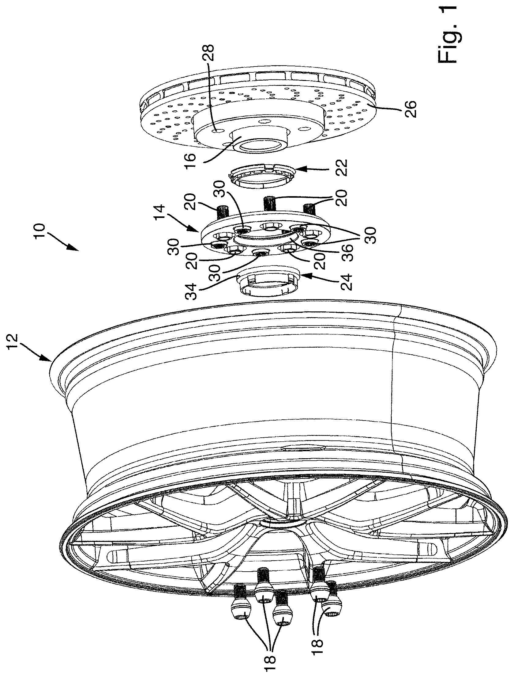 Patent US12552197 Figure 1 – Wheel system with an adapter disc