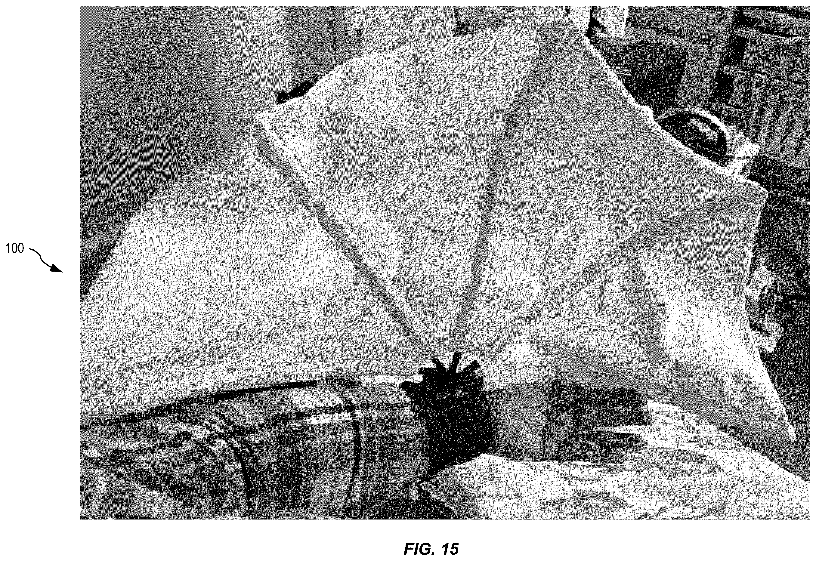 Patent US12588716 Figure 12 – Arm-mounted breastfeeding cover