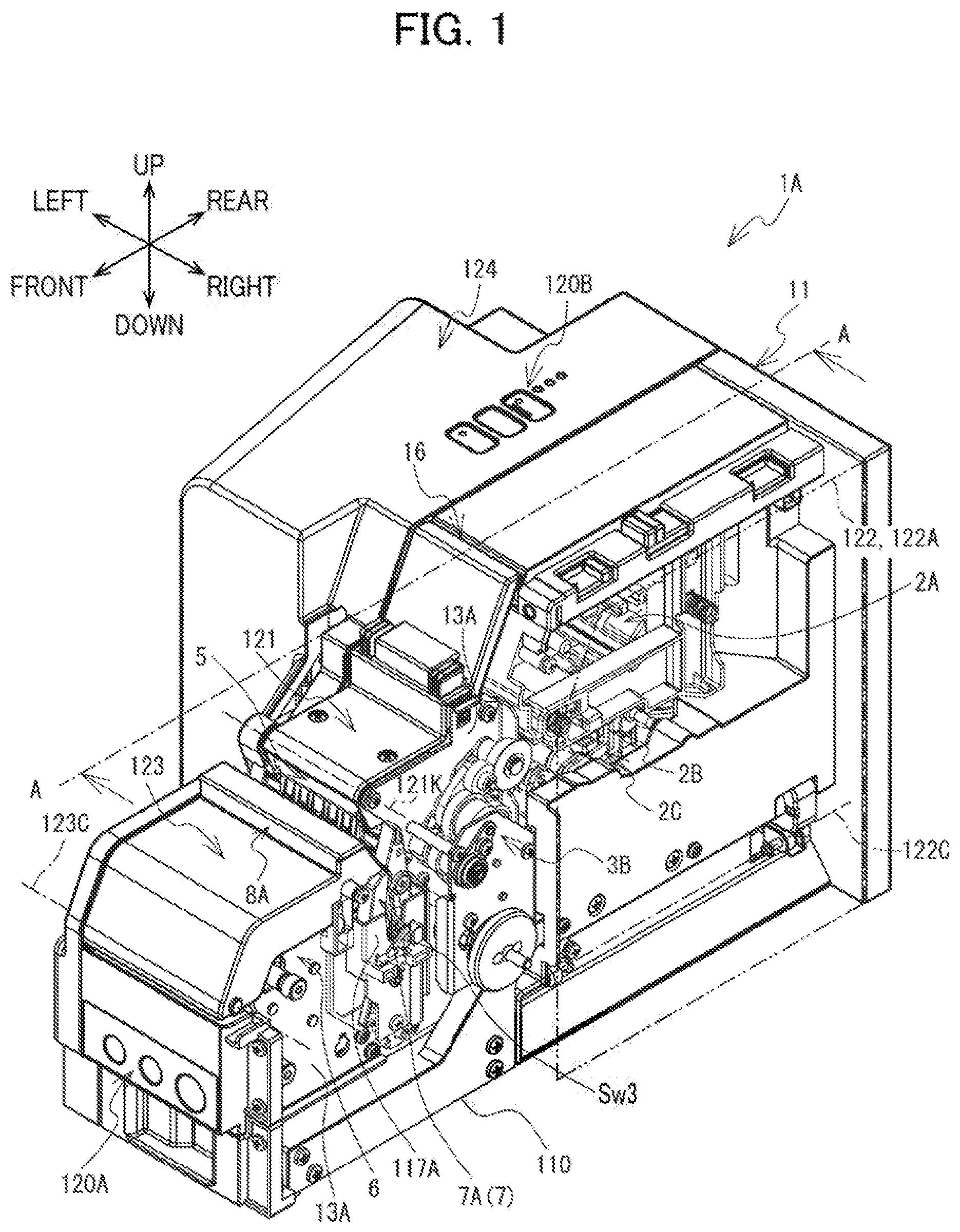 Patent US12617575 Figure 1 – Label affixing device including peeling part peeling label off release material, affixing part affixing label to adherend, and discharge part through which release material is discharged