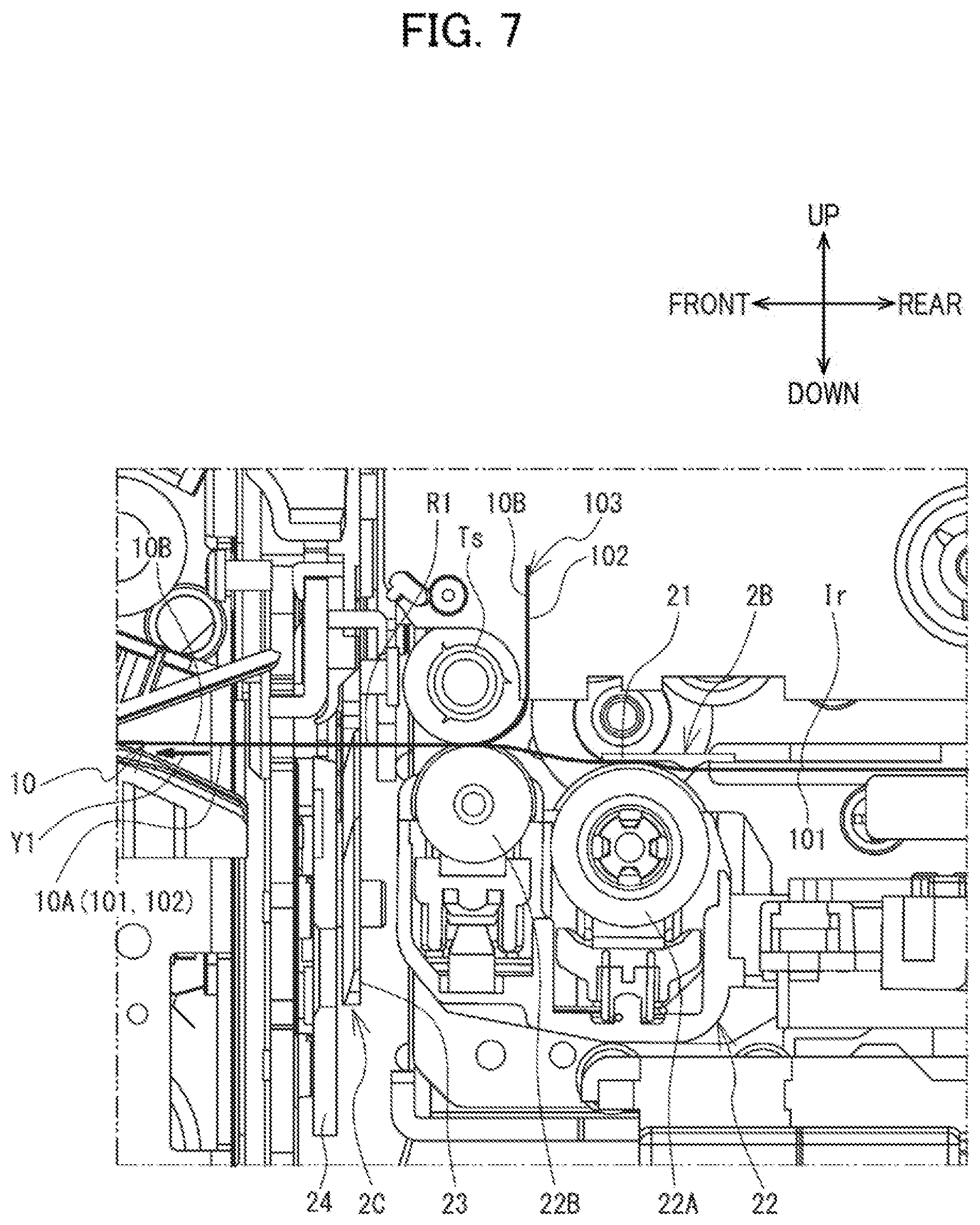Patent US12617575 Figure 7 – Label affixing device including peeling part peeling label off release material, affixing part affixing label to adherend, and discharge part through which release material is discharged