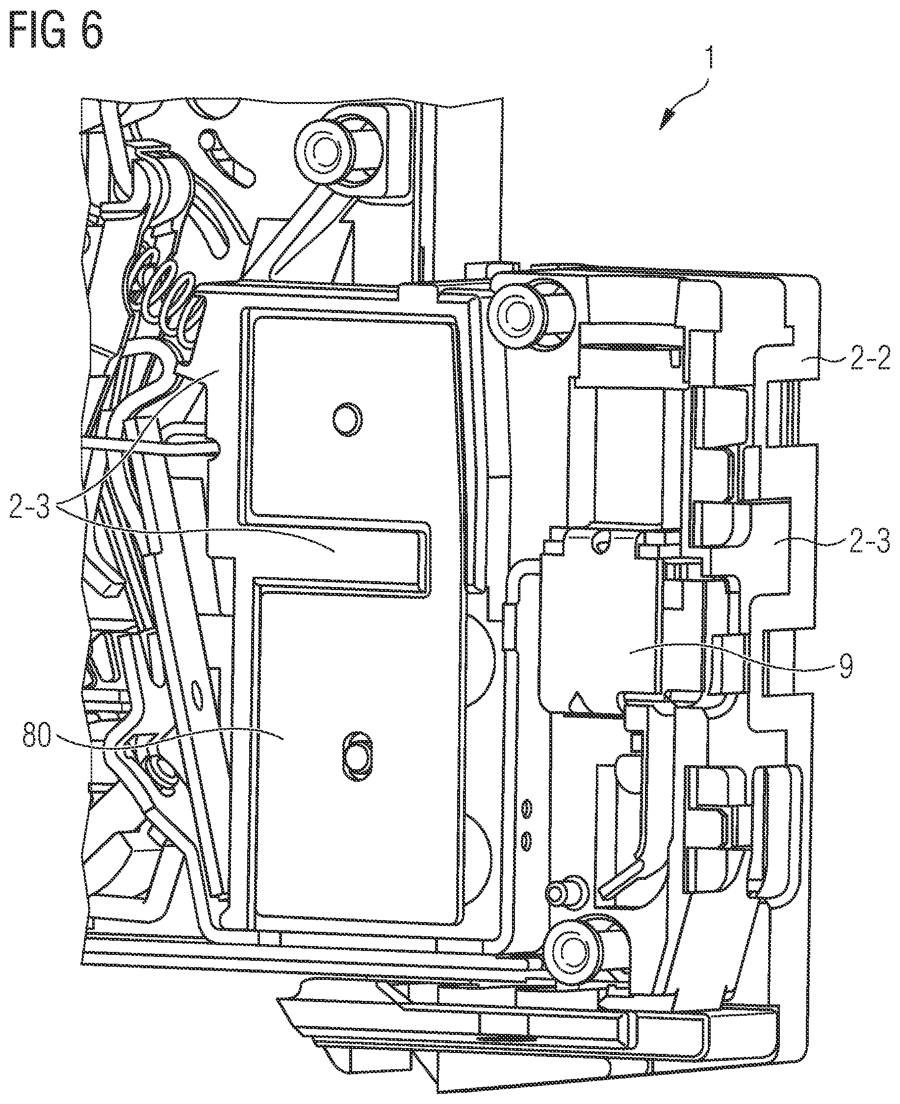 Patent US12620541 Figure 6 – Insulating-material housing and compact circuit breaker